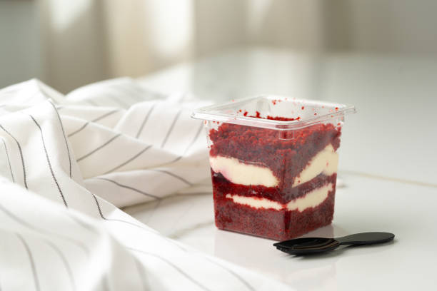 istock Trifle red velvet in plastic cup on table 2149775656