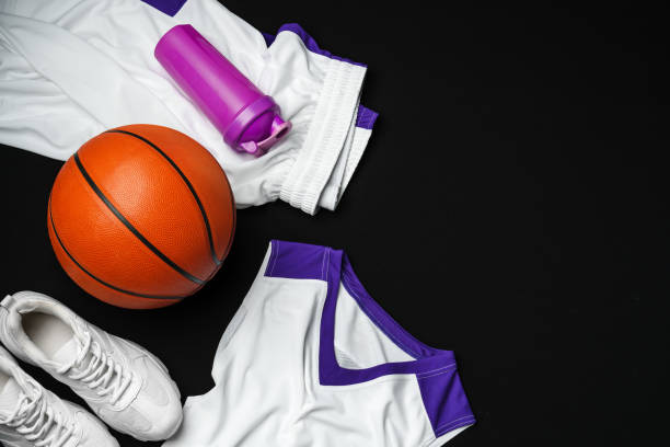 istock Basketball Gear Prepared for an Evening Training Session on a Dark Backdrop 2149775683