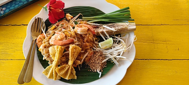 Fried noodles Thai style with shrimp (Pad Thai). One of signature food in Thailand.