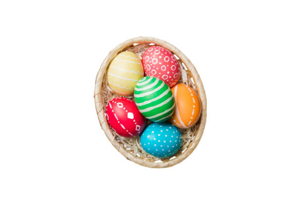 istock Basket of colorful Easter eggs isolated on white background. Easter basket filled with colored eggs top view holiday concept 2149776017