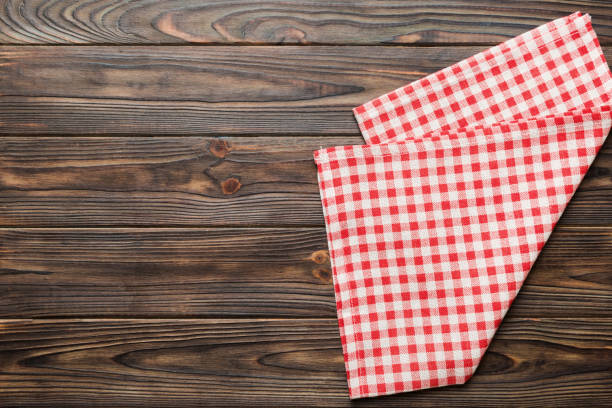 istock top view with red empty kitchen napkin isolated on table background. Folded cloth for mockup with copy space, Flat lay. Minimal style 2149776071