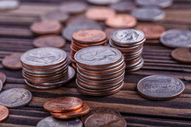 istock American coins and US dollars on a wooden table 2149777117
