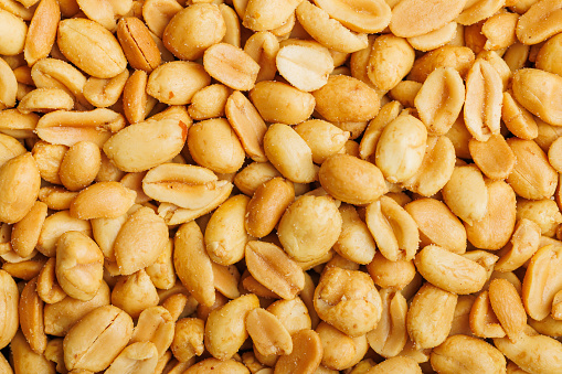 Detailed view of a diverse assortment of nuts piled together. Top view.
