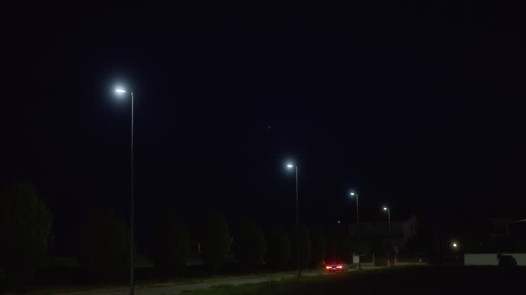 Nighttime street lights and driving retro car
