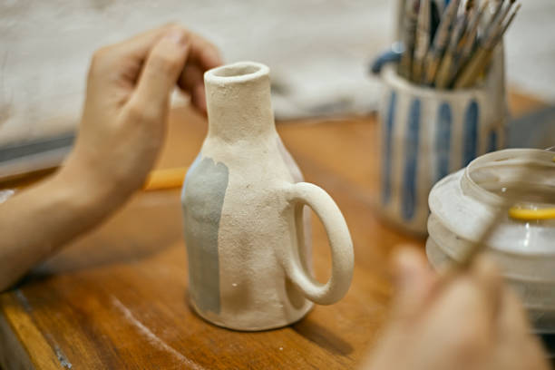 istock Close up potter painting 2149777767