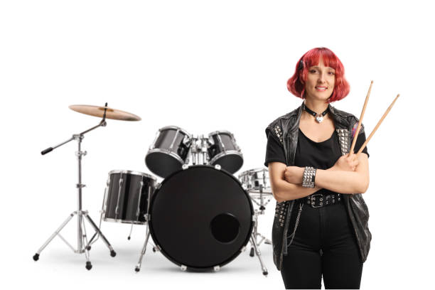 istock Young female rock drummer holding a pair of drumsticks 2149784085