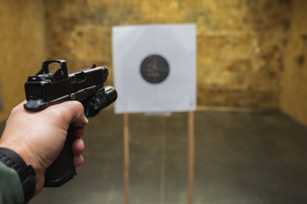 istock Tactical pistol shooting at a target in a shooting range. 2149784482