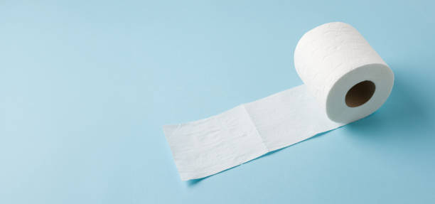 istock Top view of toilet paper roll on blue background 2149784598