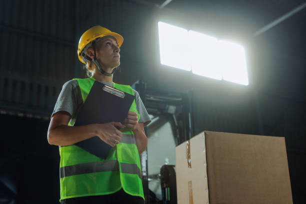 istock Customs warehouse female worker standing and holding a clipboard 2149784815