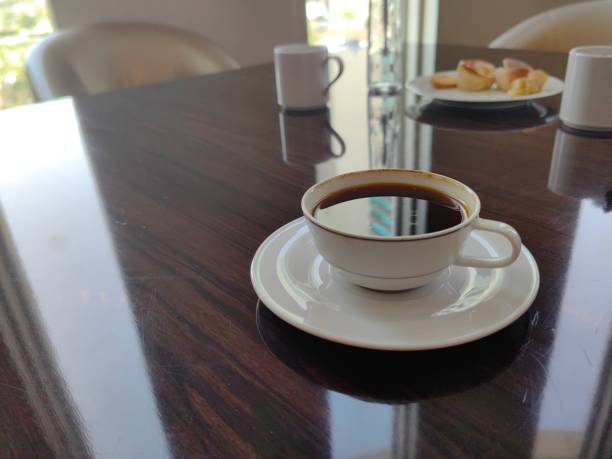 A cup of coffee on coffee break table.