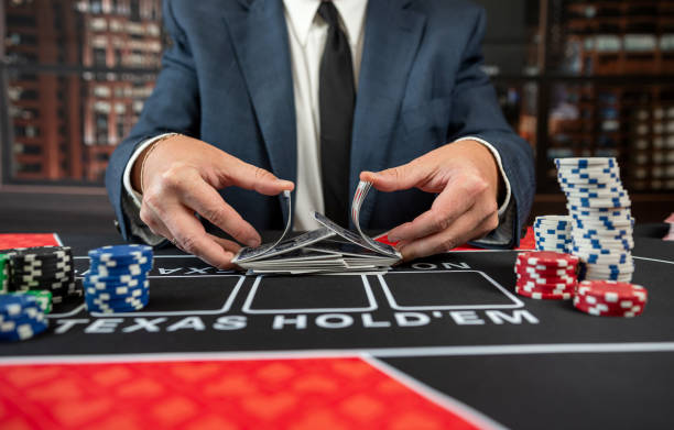 istock close up man hand with poker card at casino table 2149786011