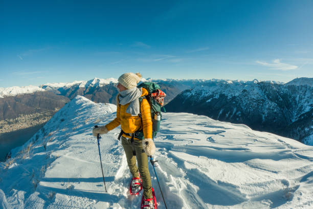 istock Side profile of woman snowshoeing 2149786134