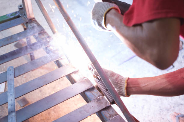 istock Human hands hold welding equipment at a job site. 2149788698