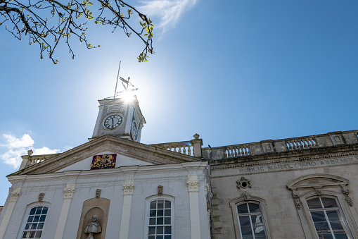 Sun shines on South Molton Town Hall in Devon, façade in the town centre