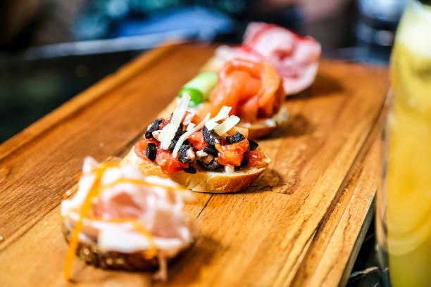 istock Wooden Cutting Board With Assorted Toppings on Sliced Bread 2149789832
