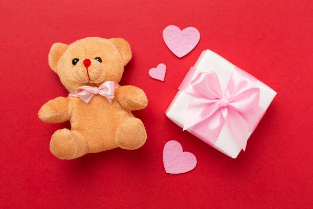 Valentines day composition with gifts on color background, top view.