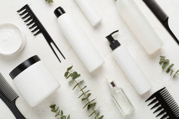 istock Professional hair care products with comb on concrete background, top view 2149791213