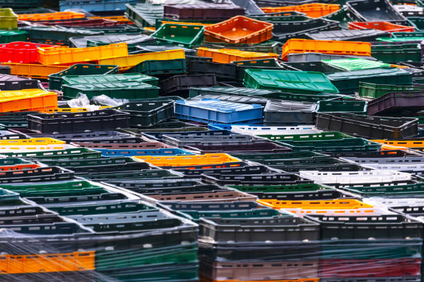 A female worker is counting in the material warehouse
