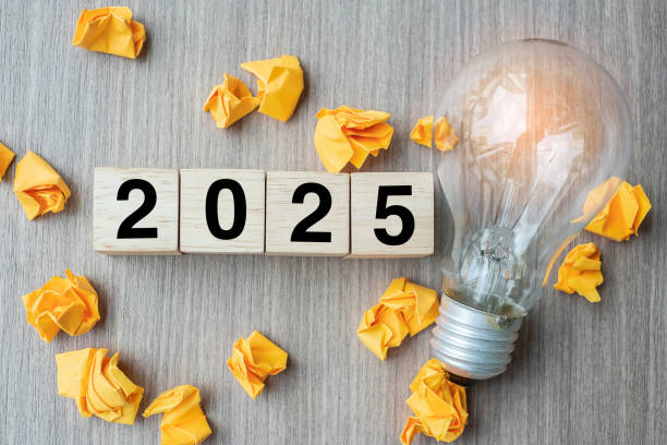istock 2025 text wood cube blocks and crumbled paper with lightbulb on wooden table background. New Year New Ideas, Creative, Innovation, Imagination, inspiration, Resolution, Strategy and goal concept 2149791552