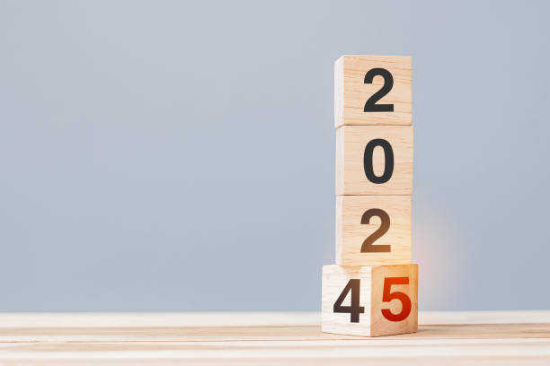 istock 2024 chang to 2025 wooden cube blocks on table background. Resolution, plan, review, goal, start, end year  and New Year holiday concepts 2149791715