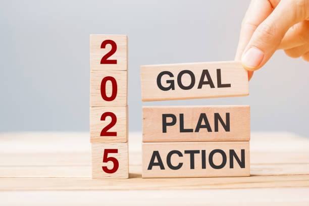 istock hand holding wooden block with text 2025 GOAL, PLAN and ACTION on table background. Resolution, strategy, solution, goal, business and New Year holiday concepts 2149791728