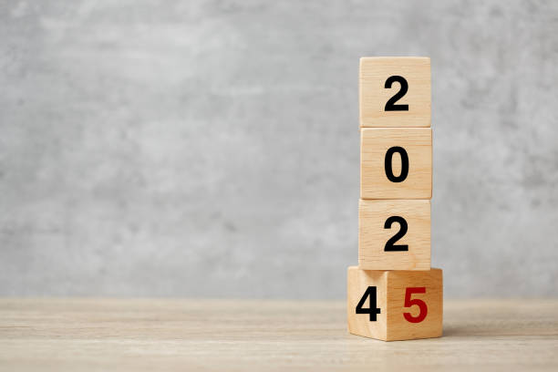 istock block flipping 2024  to 2025 text on table. Resolution, strategy, plan, goal, motivation, reboot, business and New Year holiday concepts 2149791747