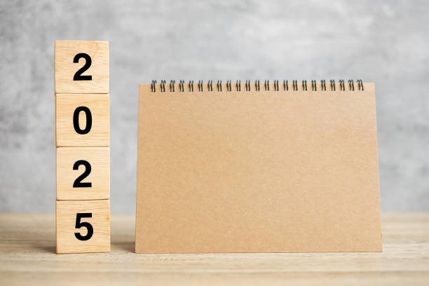 istock 2025 Happy New Year with blank notebook and wooden number. countdown, Resolution, Goals, Plan, Action and Mission Concept 2149791791
