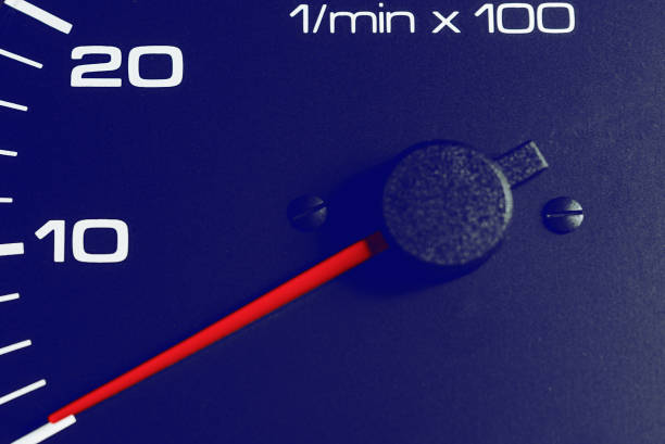 Black Car speedometer,dashboard.Red Arrow of odometer,tachometer.Close up.Selective focus.Close up.Toned.