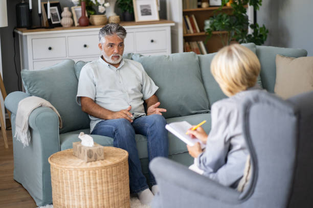 istock Man in therapy meeting with therapist 2149792149