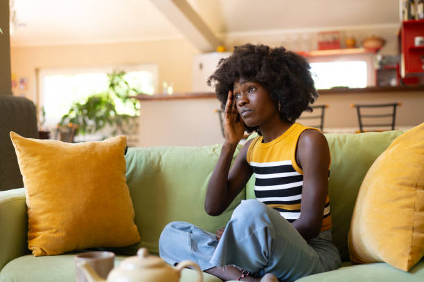 istock Woman with a headache in her apartment 2149792189