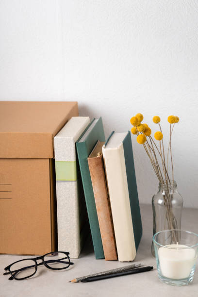 istock neat bookshelf with glasses and candle. work and study space 2149793485