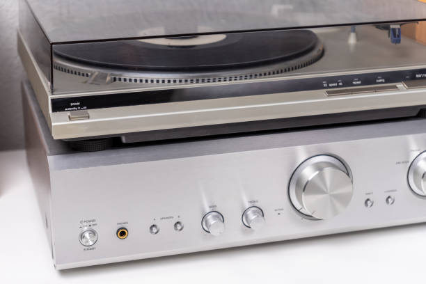 istock vintage vinyl player with amplifier and loudspeakers on white table 2149794056