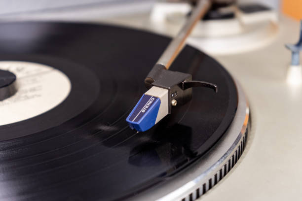 istock vintage vinyl player with amplifier and loudspeakers on white table 2149794210