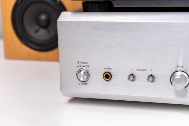 istock vintage vinyl player with amplifier and loudspeakers on white table 2149794213