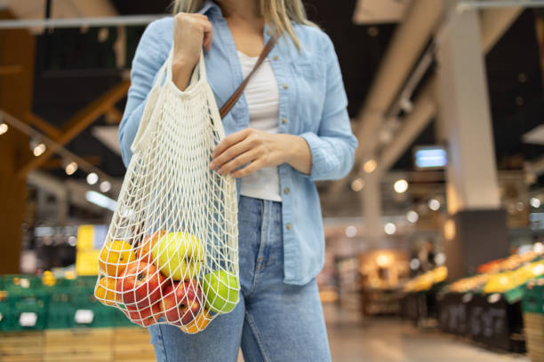 istock Woman shopping with eco-friendly bag 2149795296