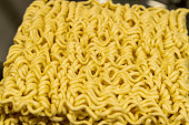 A close up of yellow noodles with a lot of twists and turns