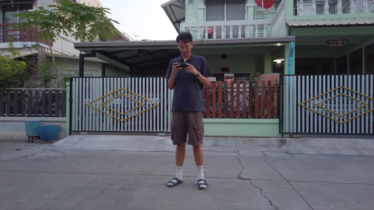 Man using phone on street