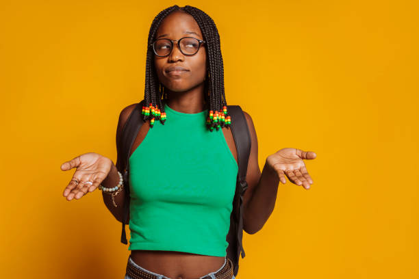istock Young african woman having doubts with hands raised 2149801717