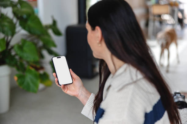istock Woman Holding Smartphone with Blank Screen 2149802254
