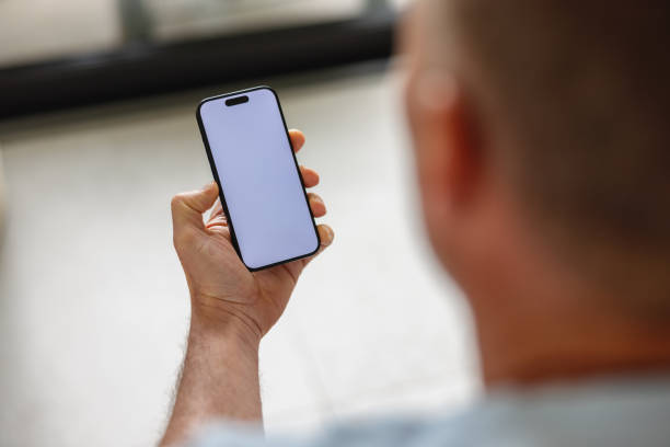 istock Close-Up of Man Holding Smartphone with White Screen 2149802256
