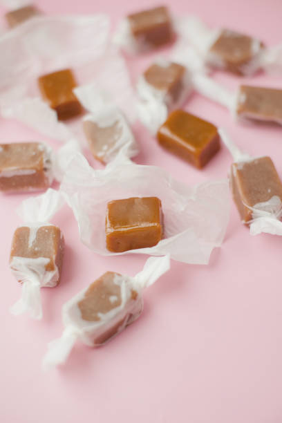 istock Caramel candy fudge in paper wrapping 2149802451