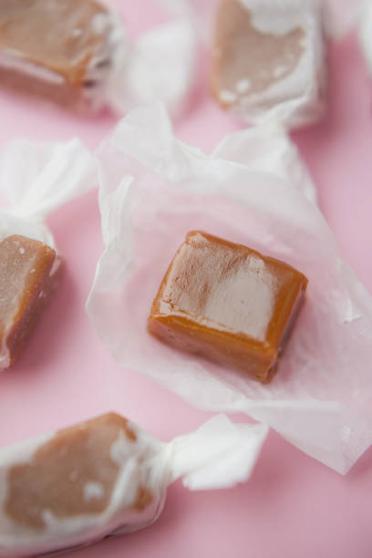 istock Caramel candy fudge in paper wrapping 2149802454
