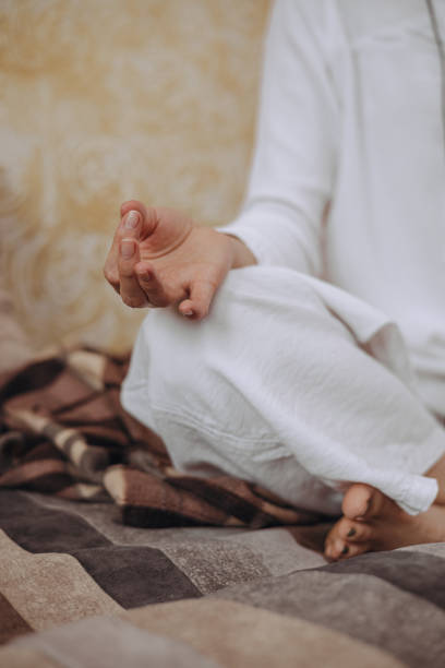 istock Woman practicing yoga with mudra hand at home 2149803233