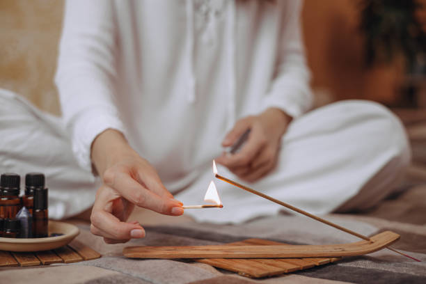 istock Woman doing aromatherapy with  incense stick and essential oils 2149804417