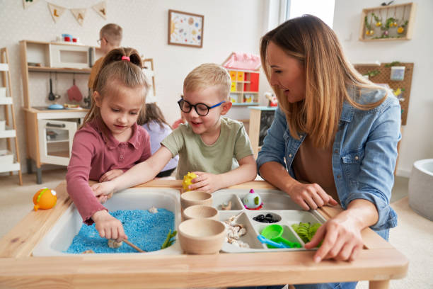 Physiotherapist doing sensory exercises with children