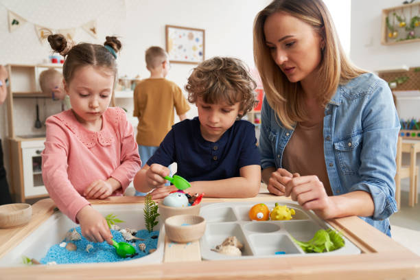istock Physiotherapist performs exercises to the children 2149805605