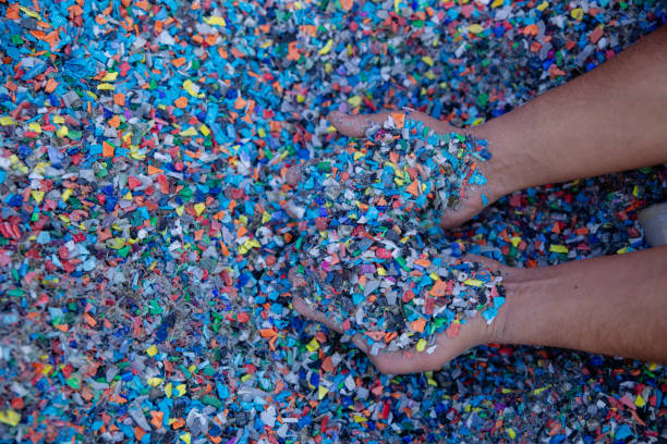 istock Plastic Resin pellets in holding hands. 2149806202