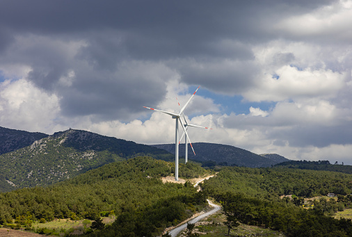 Wind power station in a forest landscape