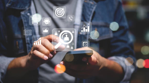 istock Digital Marketing Media Technology Graphic Concept, Business Lead And Customer Generation Magnet Pulling Figures, Businessman using mobile smart phone 2149807265