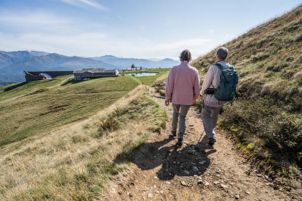 istock Senior couple explore mountain top together 2149808819